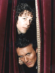 A publicity shot - Jonathan and Adam Klaus (The original one - Anthony Stewart Head)  poking their heads through a curtain