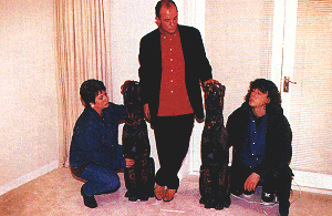 A publicity shot from No Trace of Tracy.  Jonathan, Maddy and Roy Pilgrim in the white room examining the speakers.