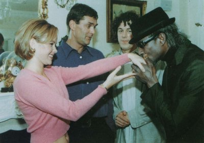 A publicity shot from the Problems at Gallows Gate, Hewie Harpwe is kissing the hand of Petra while Adam and Jonathan look on