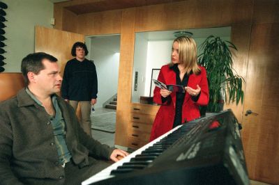A publicity shot from Angel Hair, Carla and Jonathan meet Dudley in his studio