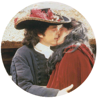 A picture from the Book The World of Jonathan Creek.  Jonathan is kissing the extra as he stands in for filming in the episode The Eyes of Tiresis